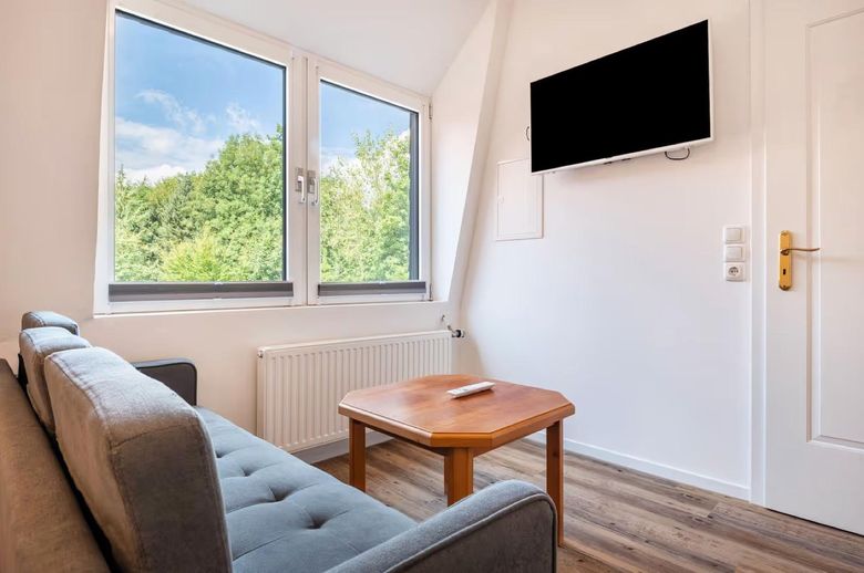 The Alter Schwede Apartment 3, cosy living room with forest view